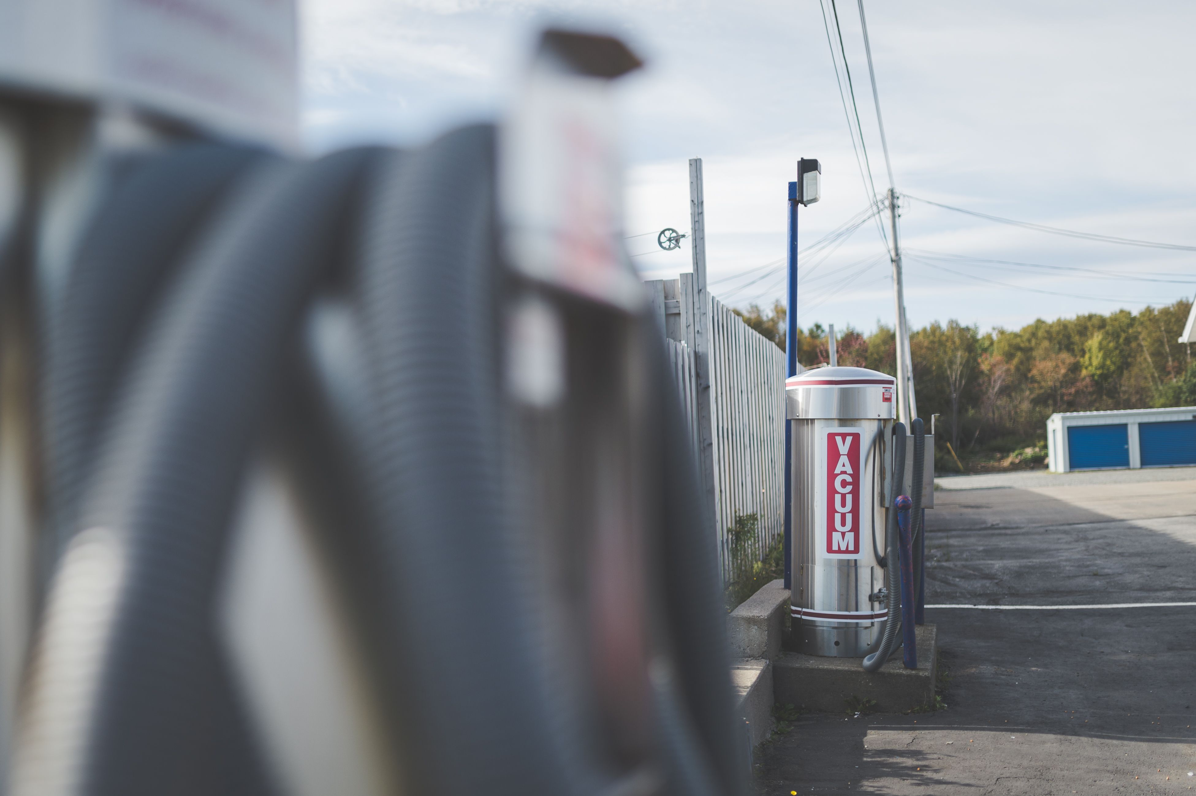 Row of self-serve vacuum stations in the parking lot